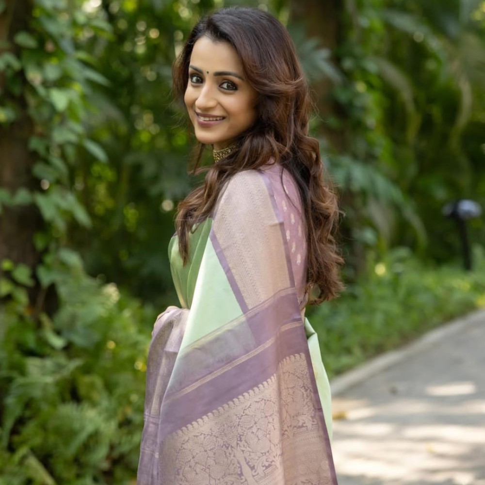 Trisha Krishnan in lavender and pista green Kanjivaram saree makes a perfect pastel com...