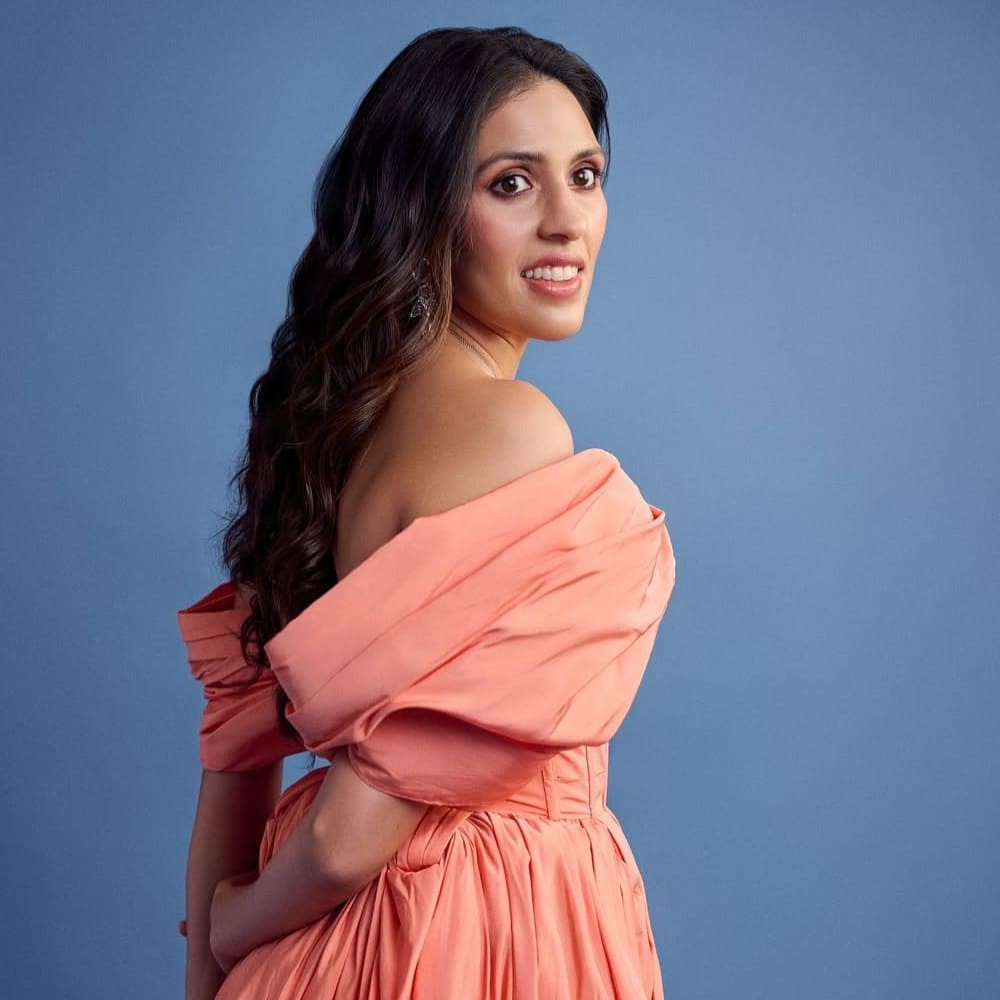 Shloka Ambani slays in Alexander McQueen off-shoulder midi dress and galactic flower sa...