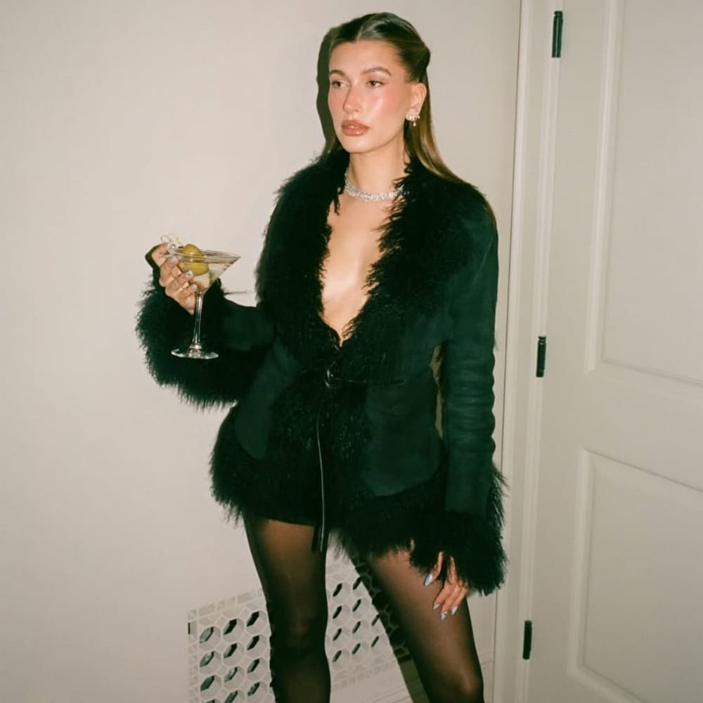Hailey Bieber in black fur jacket and mini-skirt with a hint of sparkle is the ultimate... Hailey Bieber in black fur jacket and mini-skirt with a hint of sparkle is the ultimate...