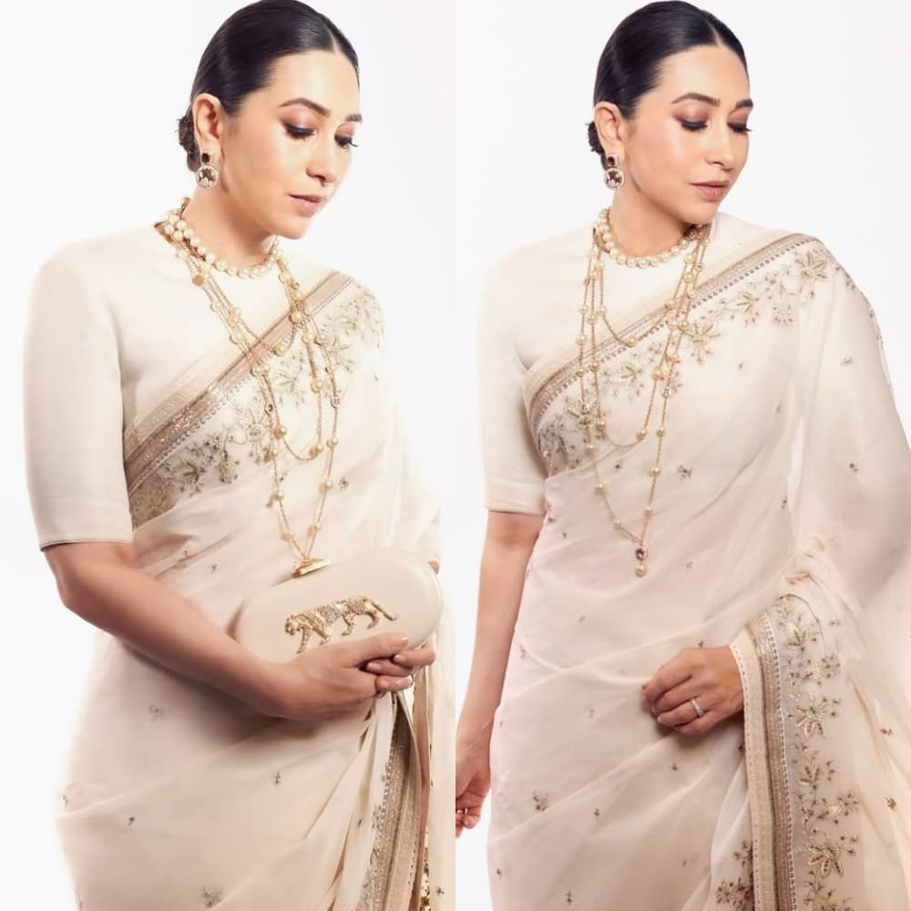 Karisma Kapoor steals spotlight in ivory saree at 100 years of Raj Kapoor event; prove...  Karisma Kapoor steals spotlight in ivory saree at 100 years of Raj Kapoor event; prove...