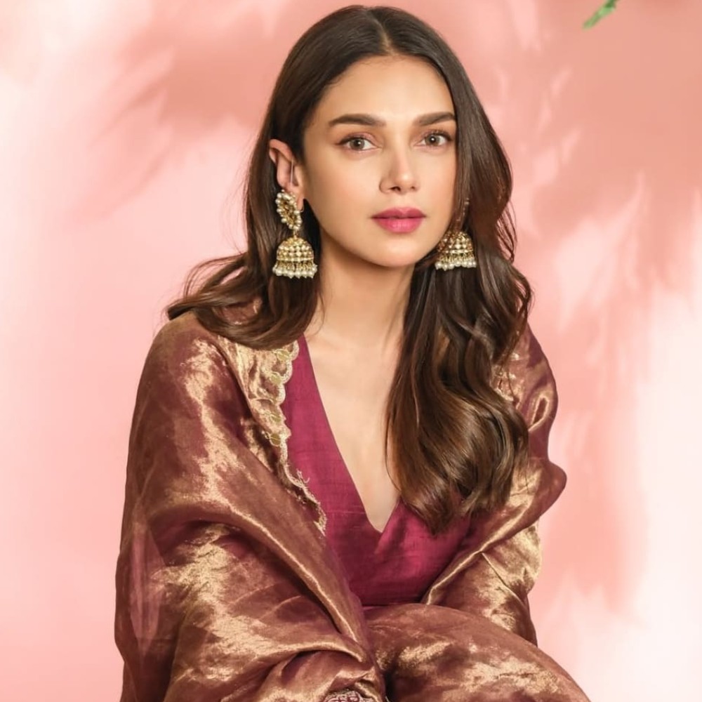Aditi Rao Hydari radiates royal elegance in wine colored Nurvi Sharara set worth Rs 49,...