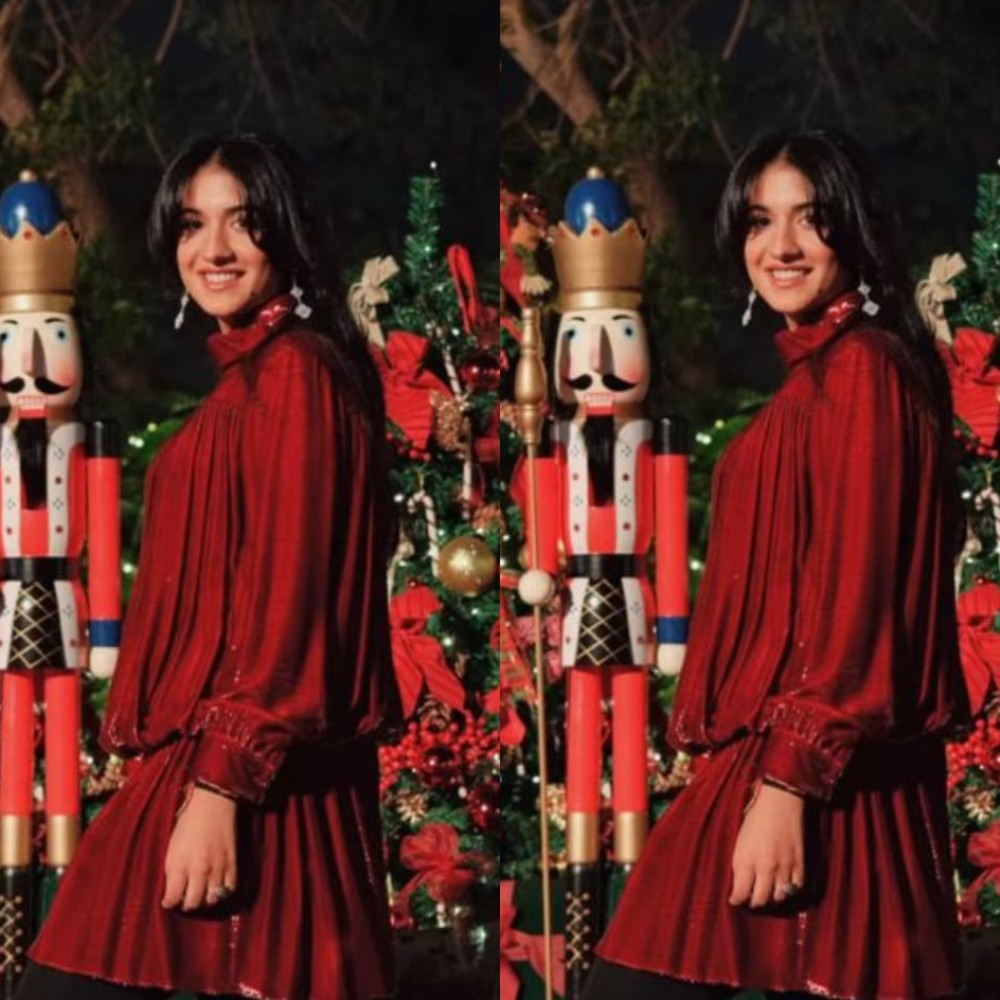 Radhika Merchant in Celine’s gathered mini dress and Havana floral boots from Jimmy Cho...