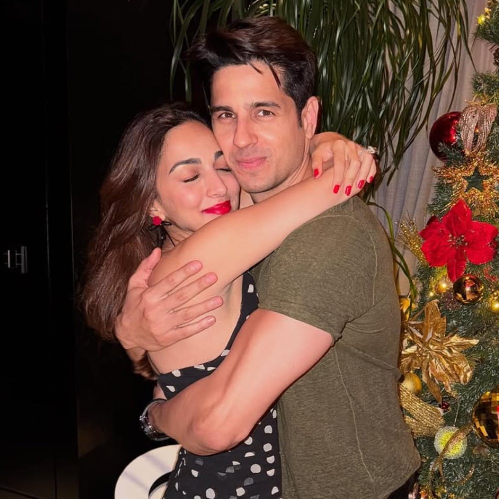 Kiara Advani adds a festive red pop to her sheer black polka dot Christmas dress as she...