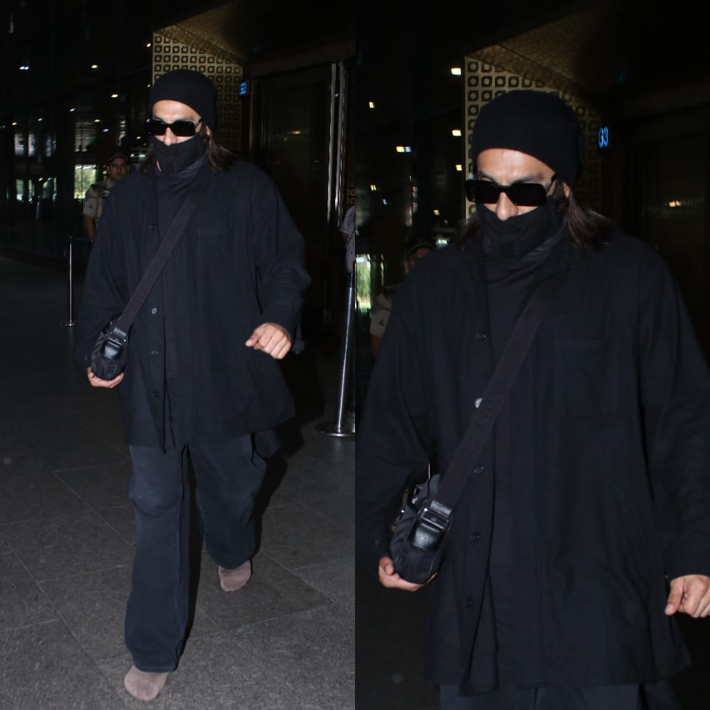 Monochrome meets minimal in Ranveer Singh’s sharp airport look; Prada sling bag and bei...