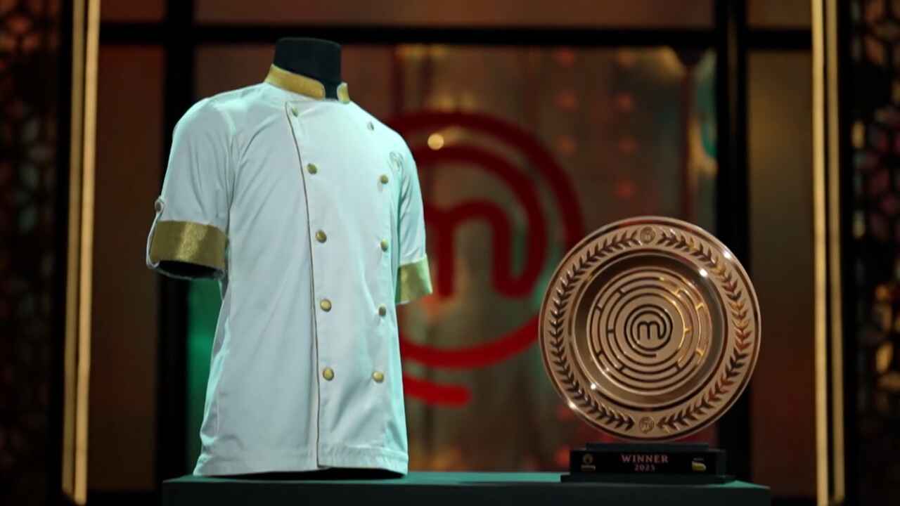 Celebrity MasterChef winner's trophy and apron