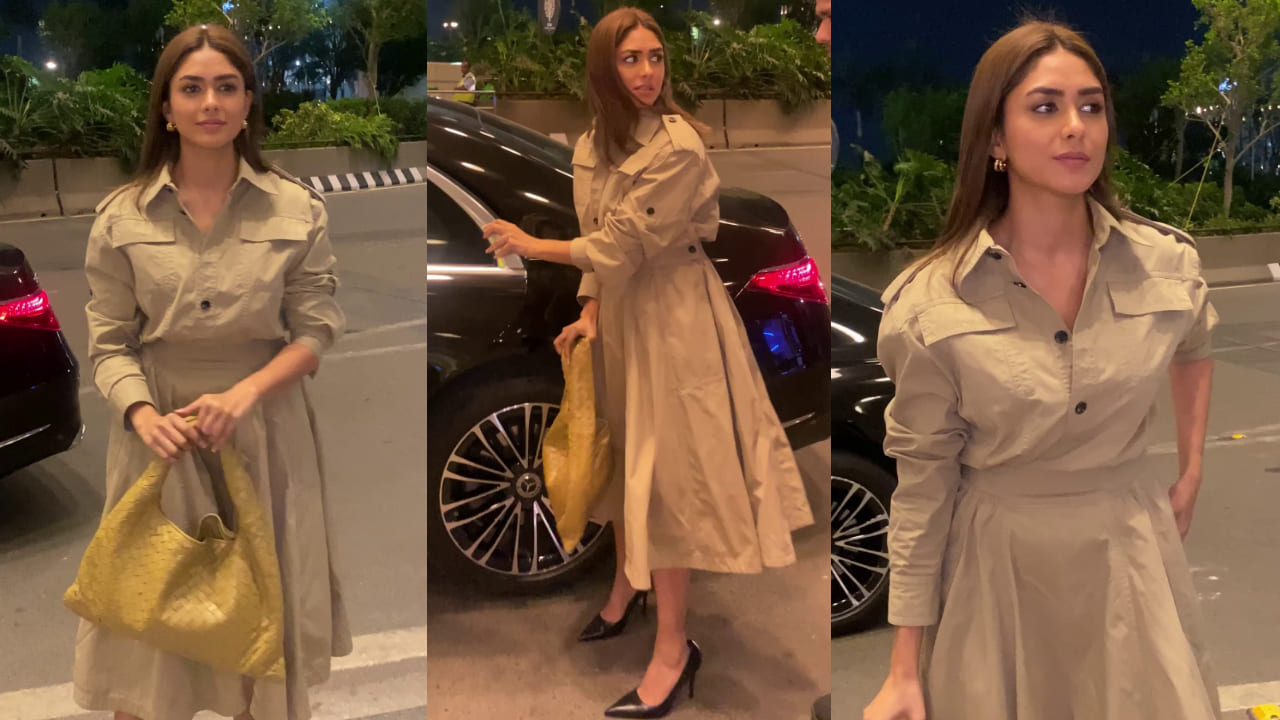 Mrunal Thakur pairs Rs 4,52,000 handbag with super elegant trench dress for her airport look. PC: Varinder