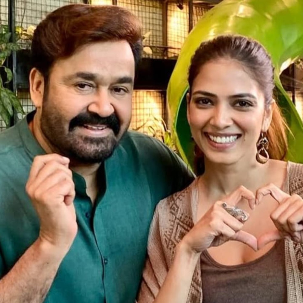 Mohanlal looks like an absolute pookie, posing alongside Malavika Mohanan from Hridayapoorvam sets; PICS