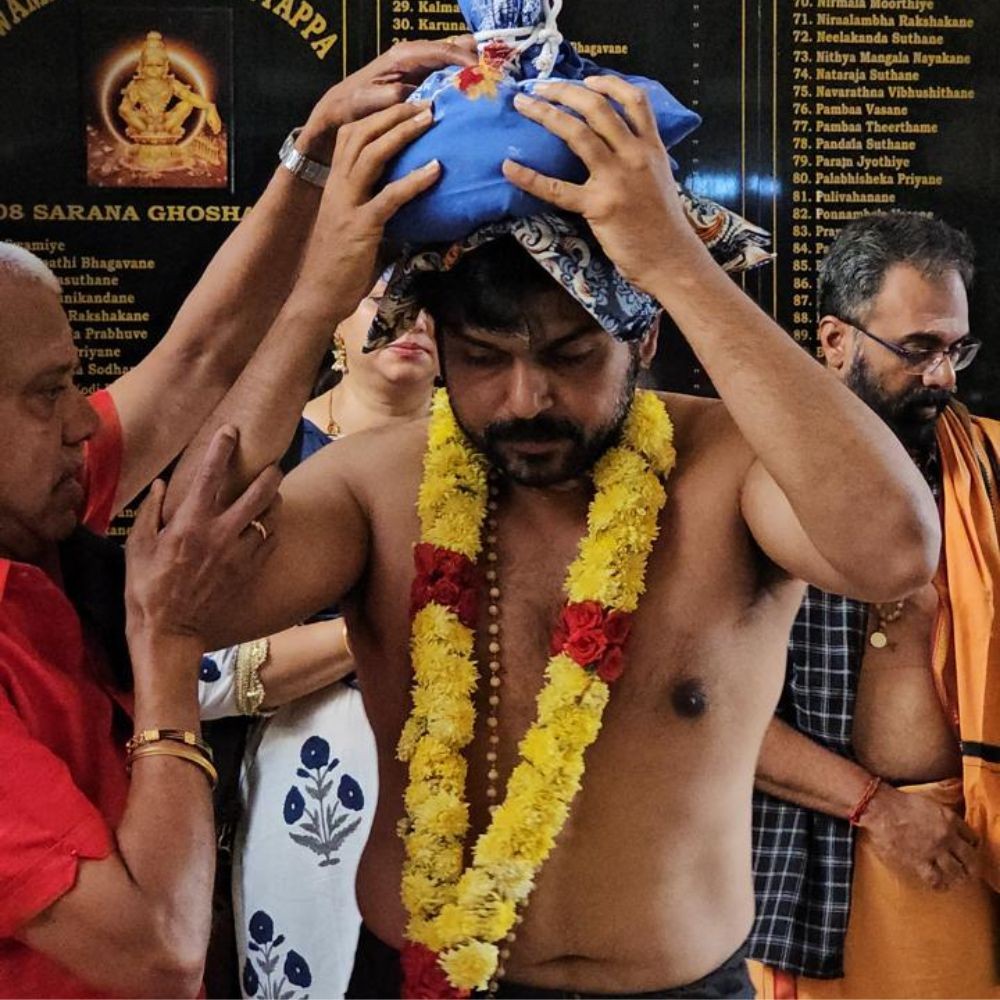 Karthi wears a traditional mundu and rudraksh mala as he seeks blessings at Sabarimala Temple