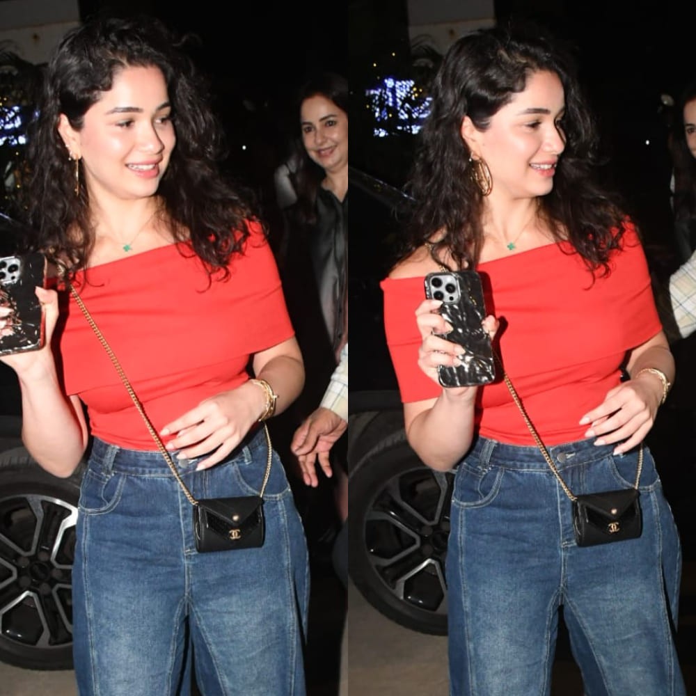 Sara Tendulkar flaunts her pocket-sized black Chanel bag with an off-shoulder red top at a family outing