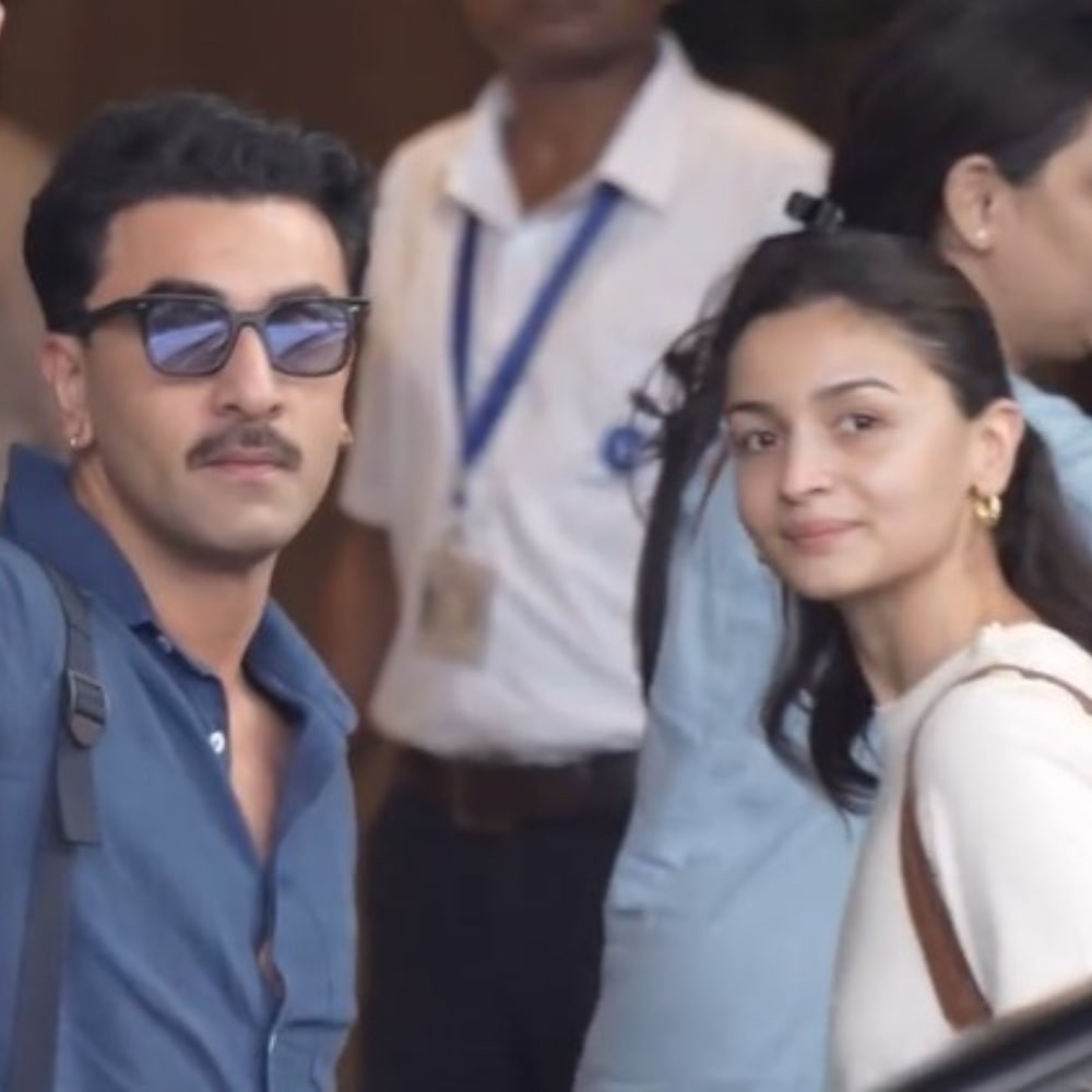 Ranbir Kapoor performs husband duties as he returns to Mumbai with Alia Bhatt after quick getaway; WATCH