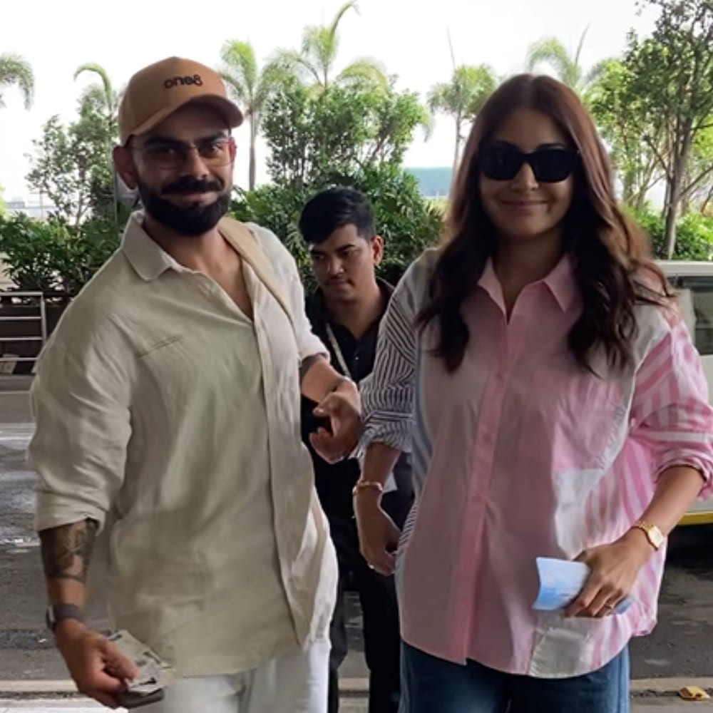 Travel Look: Virat Kohli and Anushka Sharma play it cool in oversized shirts at Mumbai airport