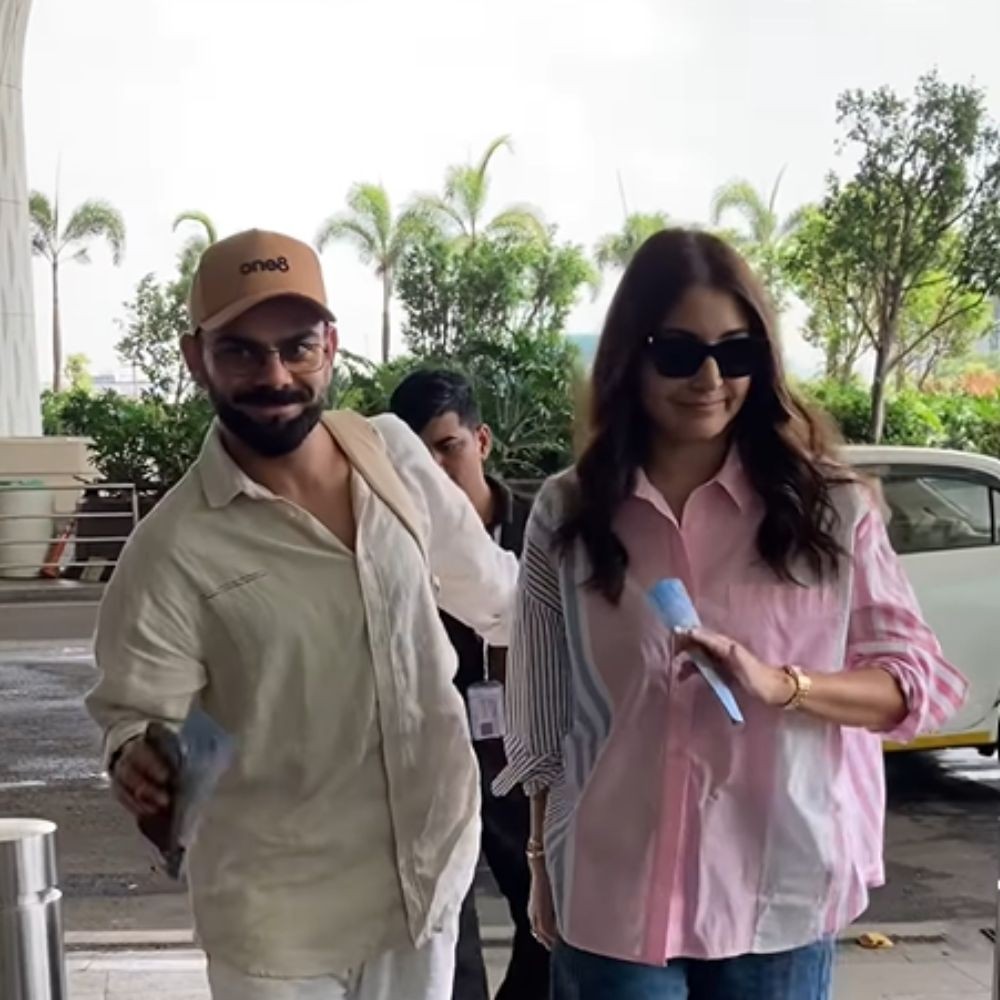 Not hand-in-hand but Virat Kohli and Anushka Sharma walked like THIS as they jet off in style from Mumbai airport; WATCH