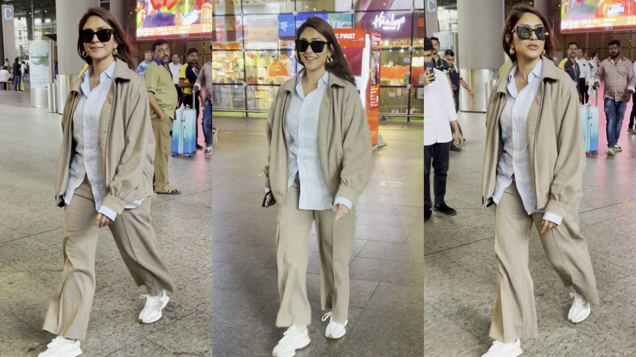 Mrunal Thakur wears comfy tracksuit with formal shirt and Rs 23,000 sunglasses at Mumbai airport. PC: APH Images