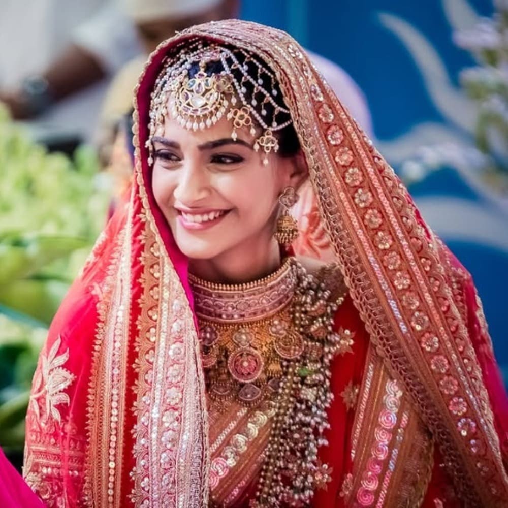 Sonam Kapoor's red and gold Anuradha Vakil wedding lehenga took six months to make, but highlight was multi-stranded matha patti