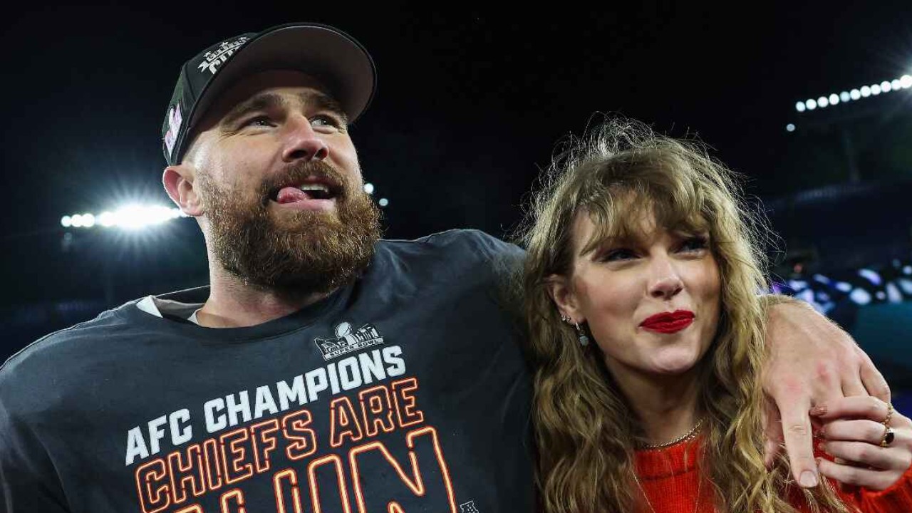 Travis Kelce ad Taylor Swift via Getty Images Getty Images