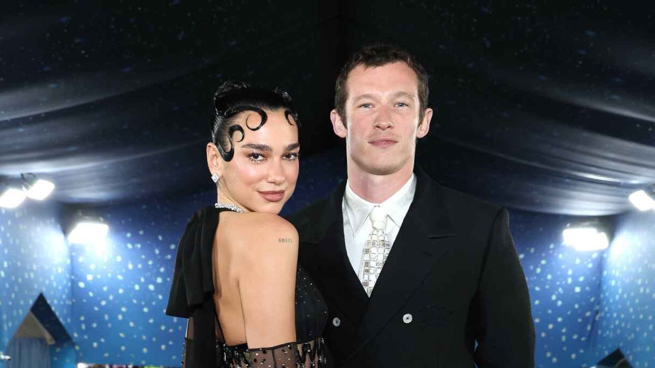Dua Lipa and Callum Turner via Getty Images Getty Images