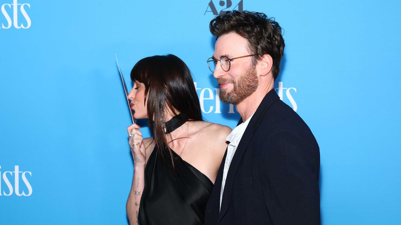 Dakota Johnson and Chris Evans (via Getty Images)