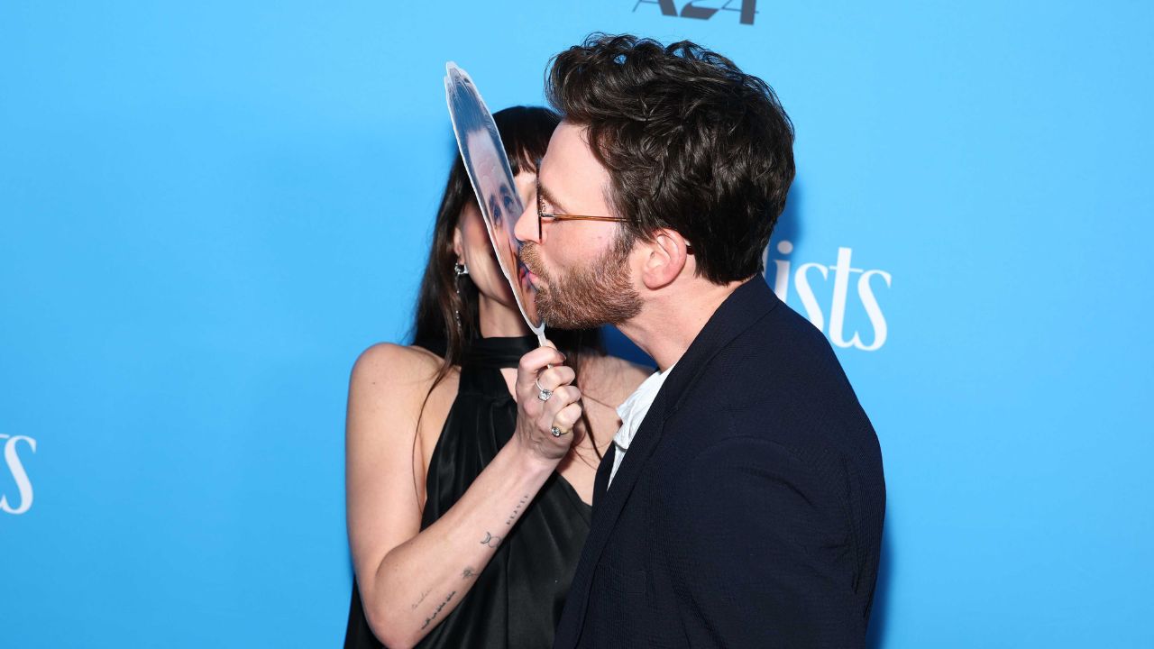 Dakota Johnson and Chris Evans (via Getty Images)