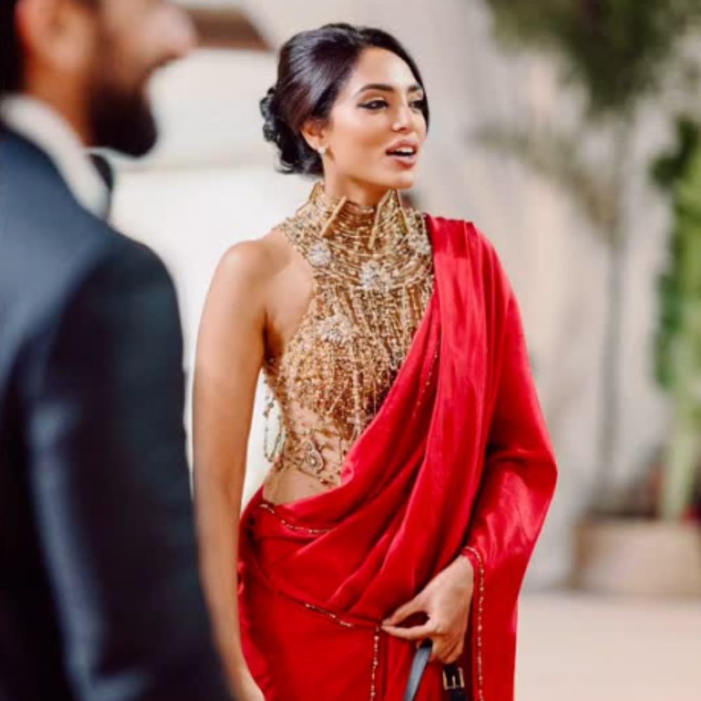 Sobhita Dhulipala styles Christian Dior bag worth Rs 3.37 Lakh with red satin saree at Akhil Akkineni-Zainab's wedding reception