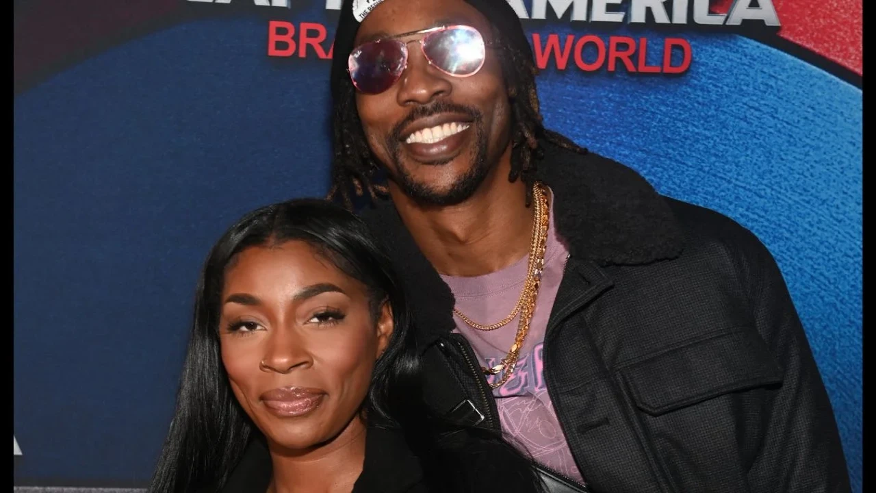 Amy Luciani & Dwight Howard (via Getty Images)