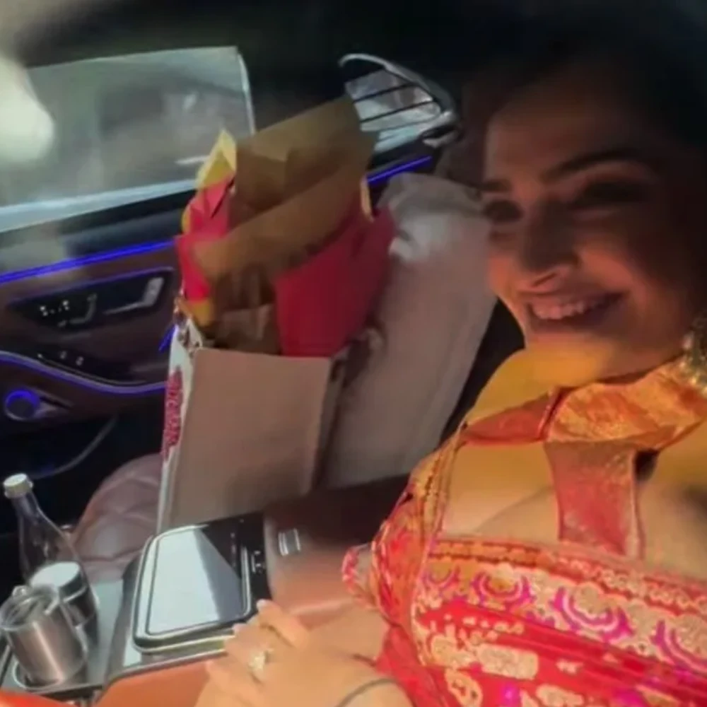 Mom-to-be Sonam Kapoor hides her baby bump as she arrives for Karva Chauth celebrations, looks stunning in red zari saree