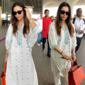 Malaika Arora dons white kurta set at Mumbai airport; styles it with Rs 6.95 lacs Louis Vuitton bag