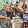 VIRAL PHOTOS: Ajith Kumar clicked in candid moment as he cooks Biryani; enjoys eating with friends