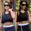Nora Fatehi in a black skirt and crop top serves as our mid-week motivation to get up and hit the gym