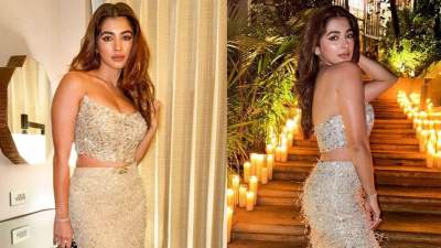 Pooja Hegde enchants the room in a gleaming nude colored strapless top and matching skirt 