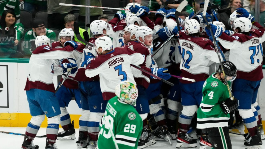 Colorado Avalanche celebrates with teammates after scoring the game winning goal during OT against the Dallas Stars 